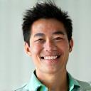 Portrait of Mark Chen, an energetic fitness and lifestyle coach with a focus on active aging and strength training.
