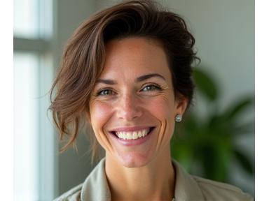 Portrait of Elara Vance, a Vitalife Canopy certified health coach with a warm, encouraging smile